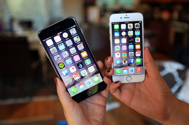 iPhone 6 and 6 Plus in hand