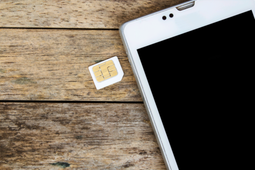 SIM card and phone on desk